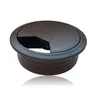 A black desk grommet with a hinged lid is shown against a white background. Podgląd zdjęcia produktu