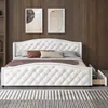 A white upholstered bed with tufted detailing and a pull-out drawer is shown in a bedroom setting. Náhled obrázku produktu