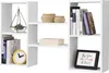 A white modular shelving unit with various decorative items and books placed on its shelves. Voir les images du produit