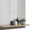 A shelf with decorative items and plants. Náhled obrázku produktu