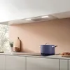 A modern kitchen scene with a blue pot on an induction stovetop. Voir les images du produit