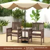 A wooden garden bench set with a table and umbrella on a wooden deck, surrounded by plants and a white wall. Produktbild-Vorschau