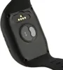Close-up view of the back of a black wearable device, showing charging contacts and a sensor. Náhľad obrázku produktu