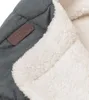 A close-up view of a gray and white fabric product with a brown brand label. Produktbild-Vorschau