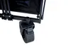 Close-up of a black wheel and part of the frame of a foldable wagon. Produktbild-Vorschau
