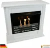 A white ethanol fireplace with a black insert and visible flames. Produktbild-Vorschau