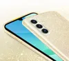 A close-up, angled shot of a gold glitter phone case on a smartphone. Produktbild-Vorschau