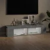 A TV stand with LED lights in a living room setting. Náhled obrázku produktu