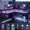 A gaming desk setup with two monitors, keyboards, and RGB lighting. Podgląd zdjęcia produktu