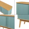 A collage of four close-up shots of a blue and wood cabinet. Podgląd zdjęcia produktu