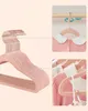 A collage of images showing pink children's hangers with rose gold hooks, demonstrating their 360-degree rotation. Náhled obrázku produktu