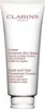 A white tube of Clarins Hand and Nail Treatment Cream. Produktbild-Vorschau