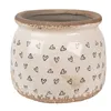A beige ceramic pot with black heart designs and a distressed rim, shown against a white background. Náhled obrázku produktu