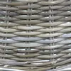 A close-up view of a woven rattan Christmas tree stand cover. Produktbild-Vorschau