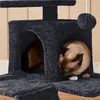 Two cats are playing on a dark gray cat tree with multiple levels and enclosed spaces. Produktbild-Vorschau