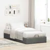 A bed with bedding in a room. Podgląd zdjęcia produktu