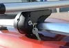 A close-up of a car roof rack with a key in the lock. Anteprima dell’immagine prodotto