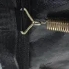 A close-up view of a black trampoline mat with a metal spring attached. Voir les images du produit