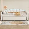 A white daybed with LED lighting and a pull-out trundle bed, styled with pillows and a blanket in a bedroom setting. Produktbild-Vorschau
