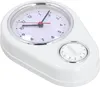 A white kitchen timer and clock with a silver trim, shown from a diagonal angle against a white background. Náhled obrázku produktu