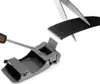 A close-up shot of a black leather belt being cut and attached to a belt buckle. Náhled obrázku produktu