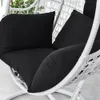 Close-up view of black cushions on a white hanging chair. Produktbild-Vorschau