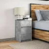 A bedside table next to a bed in a bedroom. Produktbild-Vorschau