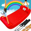 A red swing seat with ropes and carabiners, set against a backdrop of a rainbow and clouds. Produktbild-Vorschau