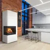 A modern living space with a fireplace, kitchen island, and stools. Produktbild-Vorschau