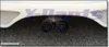 A close-up view of the rear bumper of a white car, showing two exhaust pipes with decorative turbine-like inserts. The image also features a prominent watermark and text at the bottom. Anteprima dell’immagine prodotto
