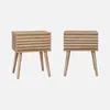 Two identical wooden nightstands with slatted fronts and tapered legs are shown against a plain light gray background. Produktbild-Vorschau