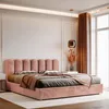 A pink velvet bed with pillows and a blanket in a bedroom. Anteprima dell’immagine prodotto