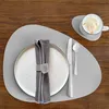 A table setting with a placemat, plate, napkin, cutlery, and a cup of coffee. Produktbild-Vorschau