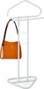 A white coat rack with a brown and orange handbag hanging on it. Náhled obrázku produktu
