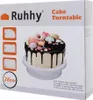 The image shows the packaging of a Ruhhy cake turntable and decorating spatulas. A decorated cake is featured on the turntable. Anteprima dell’immagine prodotto