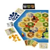 A board game with hexagonal tiles representing land and sea, along with game pieces and cards. Náhled obrázku produktu