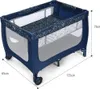 A blue travel crib with a patterned mattress. Anteprima dell’immagine prodotto
