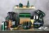 A collection of emerald green kitchen appliances and utensils arranged on a countertop against a textured gray wall. Anteprima dell’immagine prodotto