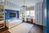 A child's bedroom with a bed, desk, and storage units. Podgląd zdjęcia produktu