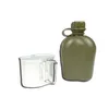 A green plastic water bottle and a silver metal cup are displayed against a white background. Podgląd zdjęcia produktu