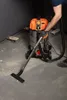 A person is using a vacuum cleaner to clean a dusty concrete floor. Náhled obrázku produktu
