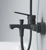 A close-up shot of a black bathroom faucet mounted on a white wall, with a white bathtub visible below. Produktbild-Vorschau