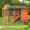 A wooden chicken coop with a run, set up on a grassy lawn with trees in the background. Produktbild-Vorschau