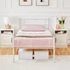 A white metal bed frame with a pink mattress and pillow, placed in a bedroom setting with nightstands on either side. Podgląd zdjęcia produktu