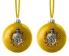 Two yellow Christmas ornaments with the Hufflepuff crest from Harry Potter. Produktbild-Vorschau
