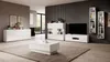 A modern living room with white furniture, including a sideboard, coffee table, and media console, set against a dark gray ribbed wall. Podgląd zdjęcia produktu