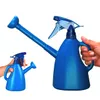 A blue watering can with a spray nozzle, shown with a smaller version in the background, both held by hands. Produktbild-Vorschau