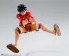 A figurine of Monkey D. Luffy from One Piece in a dynamic pose against a plain background. Podgląd zdjęcia produktu