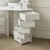 A close-up view of a white vanity table with several drawers pulled out. Voir les images du produit