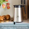 A coffee thermos and croissants are displayed on a countertop, with tulips in the background. Podgląd zdjęcia produktu